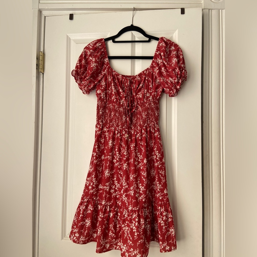 Floral smocked mini dress with ruffles and tie front